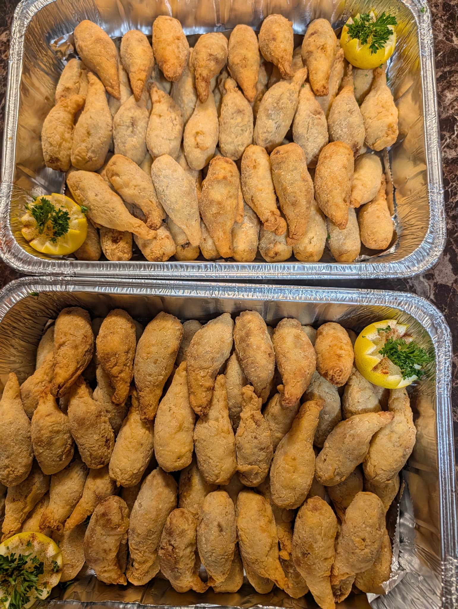 Catering trays of golden fried stuffed shrimp